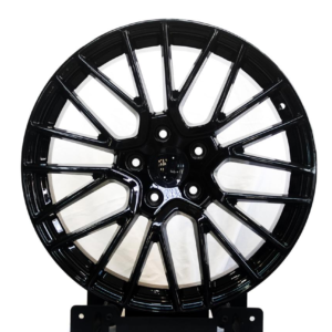 Gloss black multi-spoke alloy rim with machined accents and premium mag wheel design.