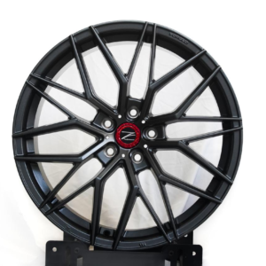 multi-spoke alloy rim featuring a red center cap, premium mag wheel design.
