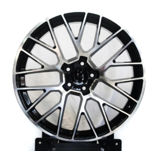 Silver and black multi-spoke alloy rim with machined face and premium mag wheel design.